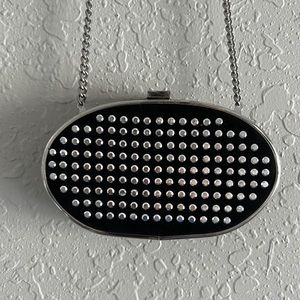 Small cross body purse. It can be used as a clutch. Not new.